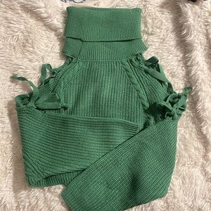 Green cropped turtleneck with tie sleeves